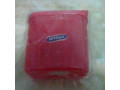 Red plastic container in original packaging